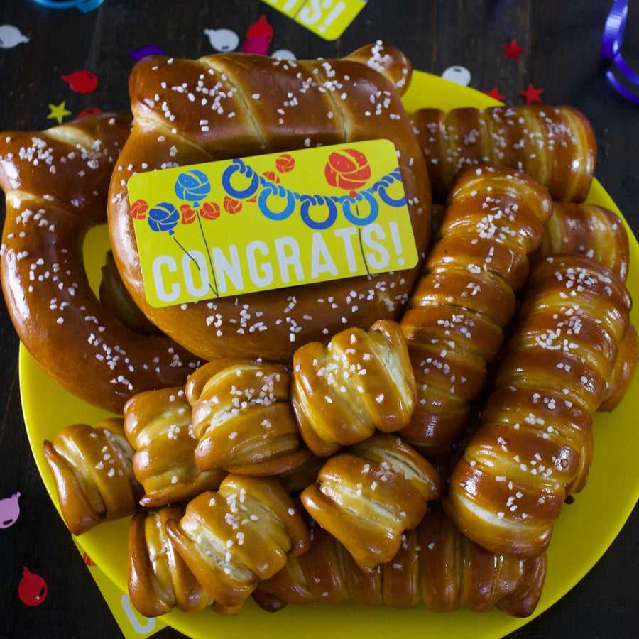 Variety soft pretzels with congratulations sticker